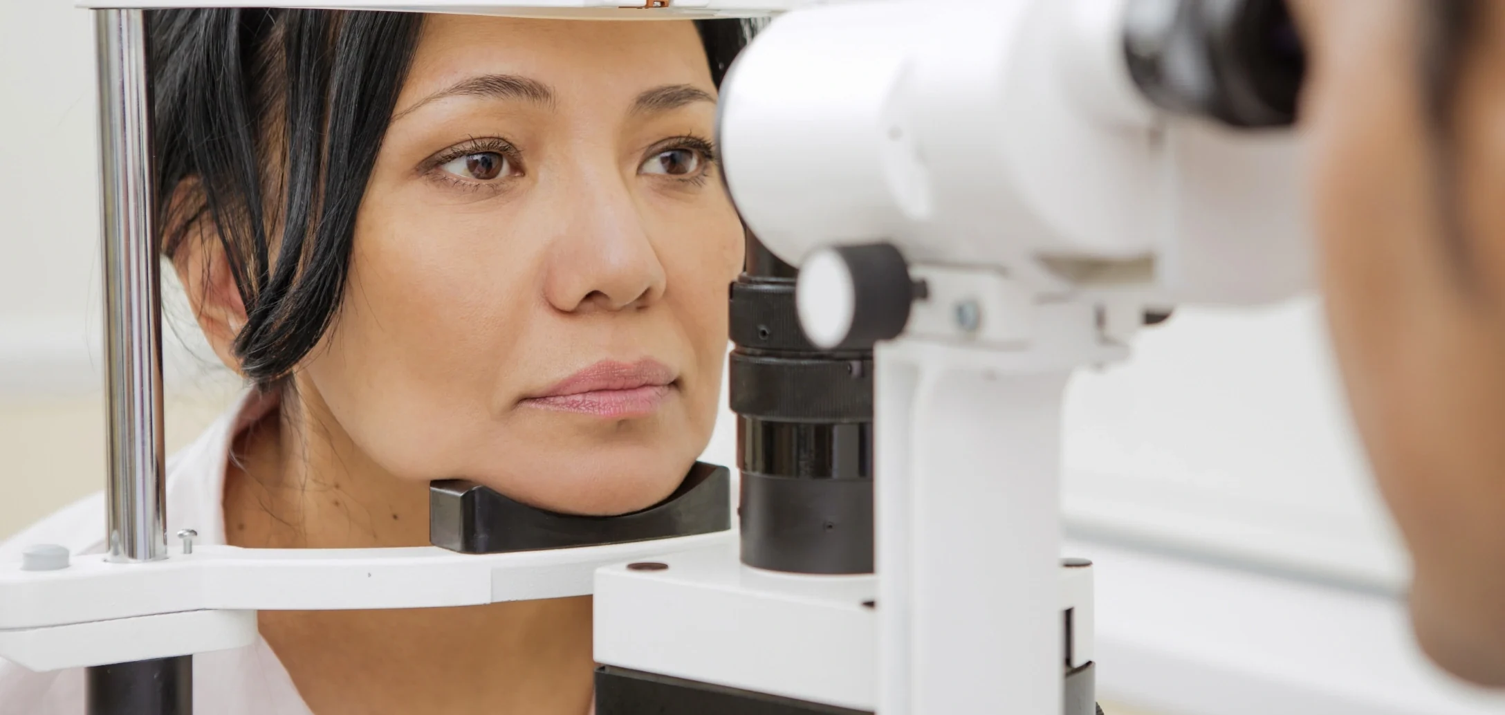 ophthalmologist examining patient