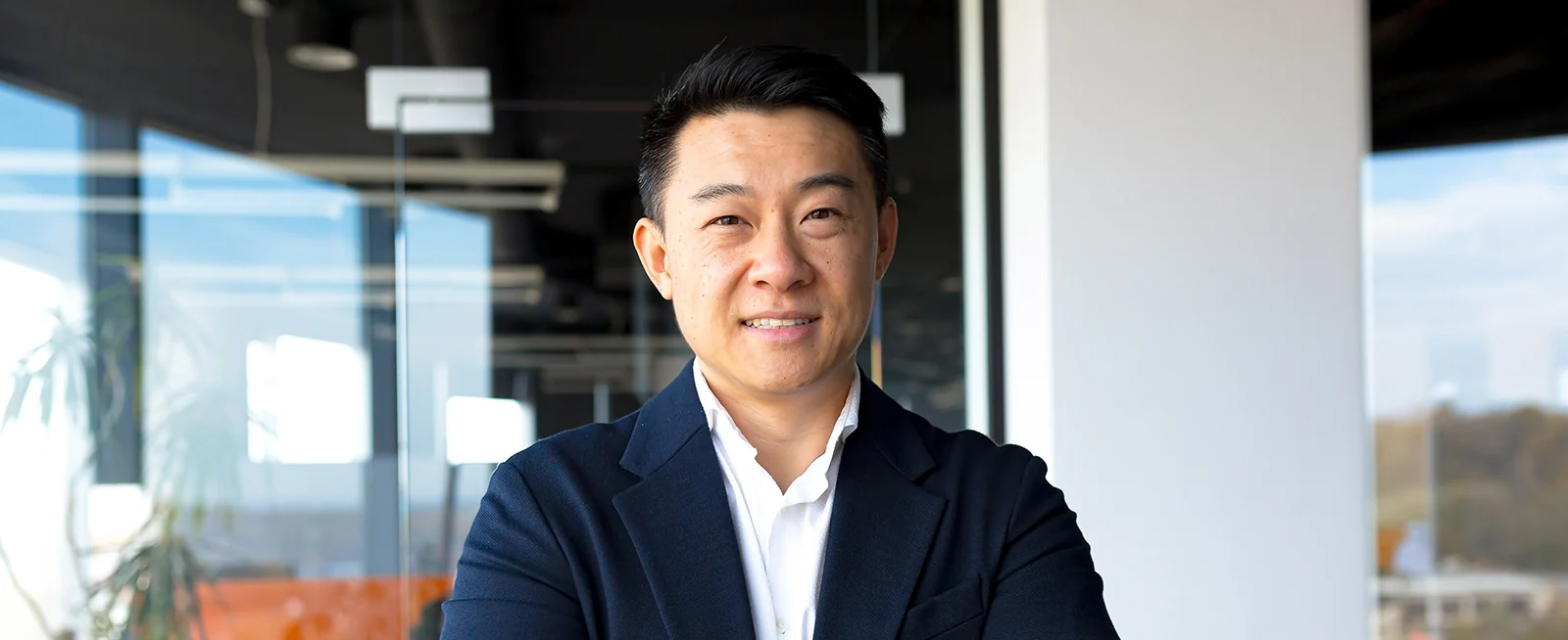 middle aged man in suit smiling