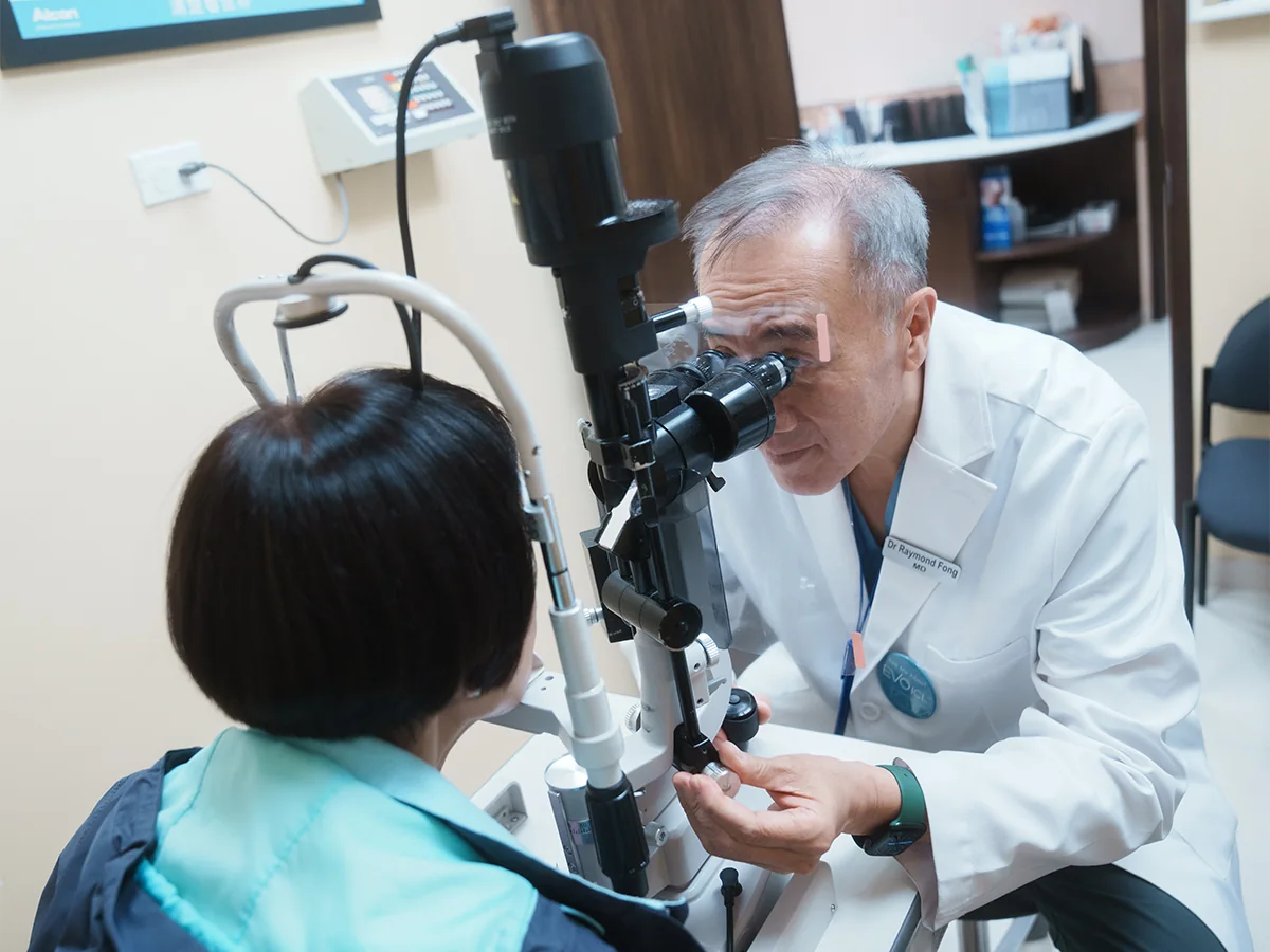 Dr. Fong examining patient's eyes